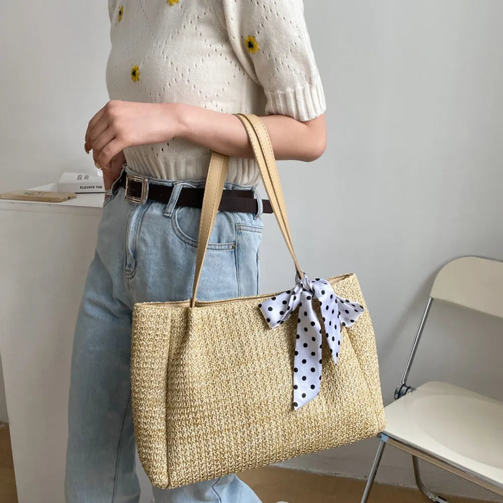 SOLINE – Woven Summer Bag with Leather Details & Bow Accent